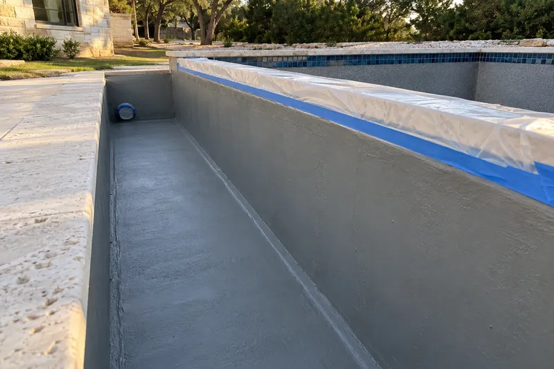 Infinity edge catch trough coated with waterproofing